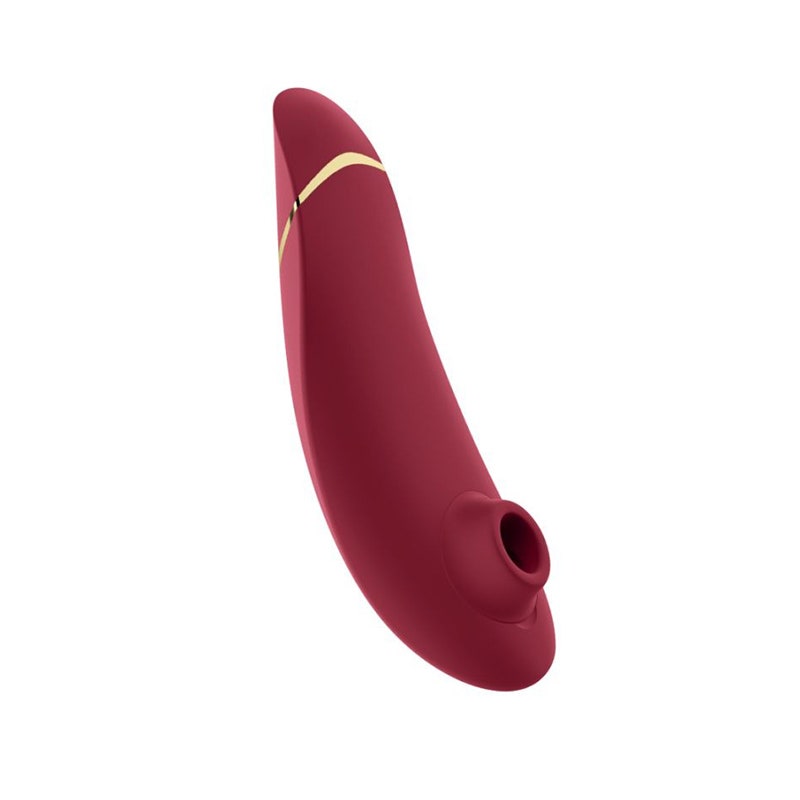 The red Womanizer Premium 2 clitoral stimulator sex toy on a white background