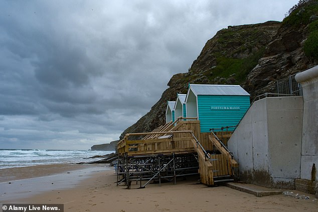 The posh beach huts in Watergate Bay have been battered by the elements just days after opening