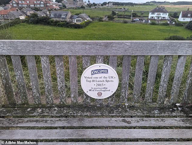 This hill beside Bamburgh Castle was once voted 'one of the UK's top 10 lunch spots', a plaque reveals