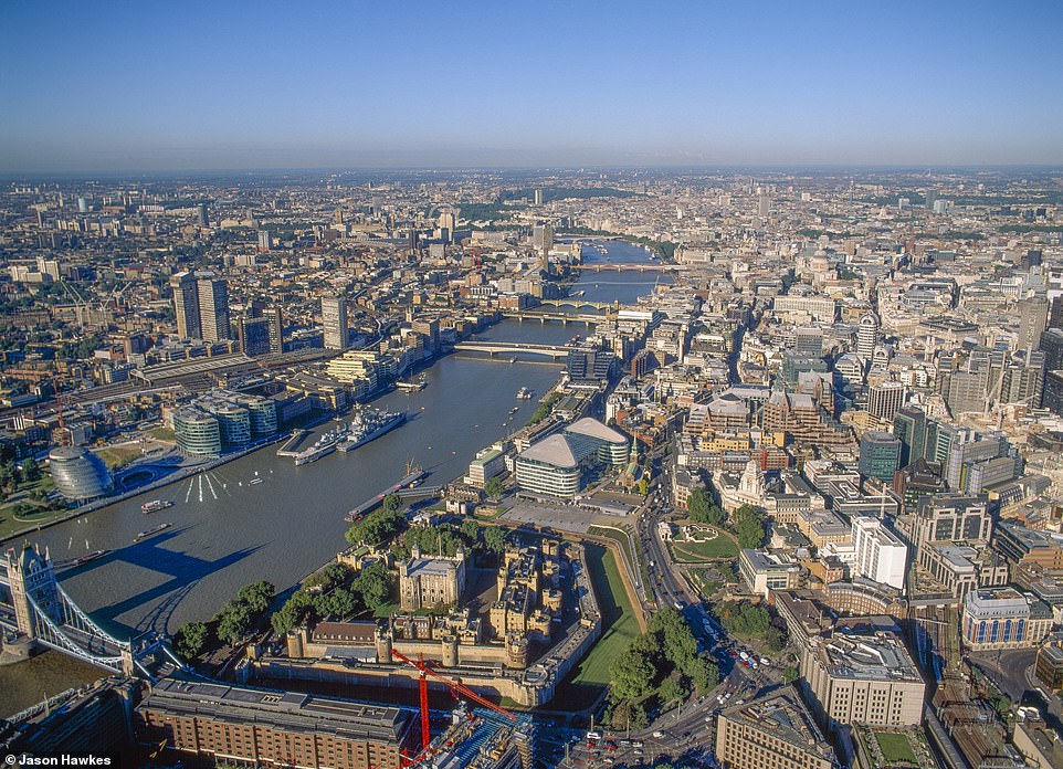 THEN: Tower of London, Corner of Tower Bridge, HMS Belfast Battleship and River Thames stretching to London Eye and Westminster before the completion of the Shard