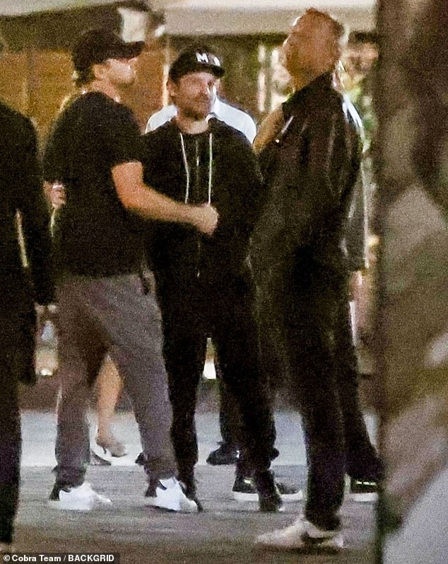 Lads' night out: Days later, a casually dressed DiCaprio was seen enjoying a late night stroll through Florence with his best actor pal, Tobey Maguire