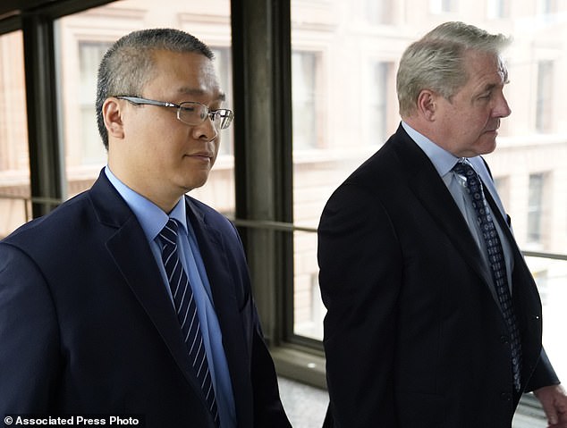 Former Minneapolis police officer Tou Thao (left) and his attorney arrive for sentencing for violating George Floyd's civil rights outside the federal courthouse in July, 2022