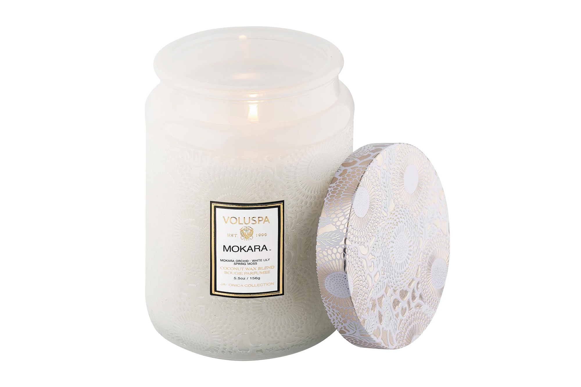 A white lit candle from Volupsa