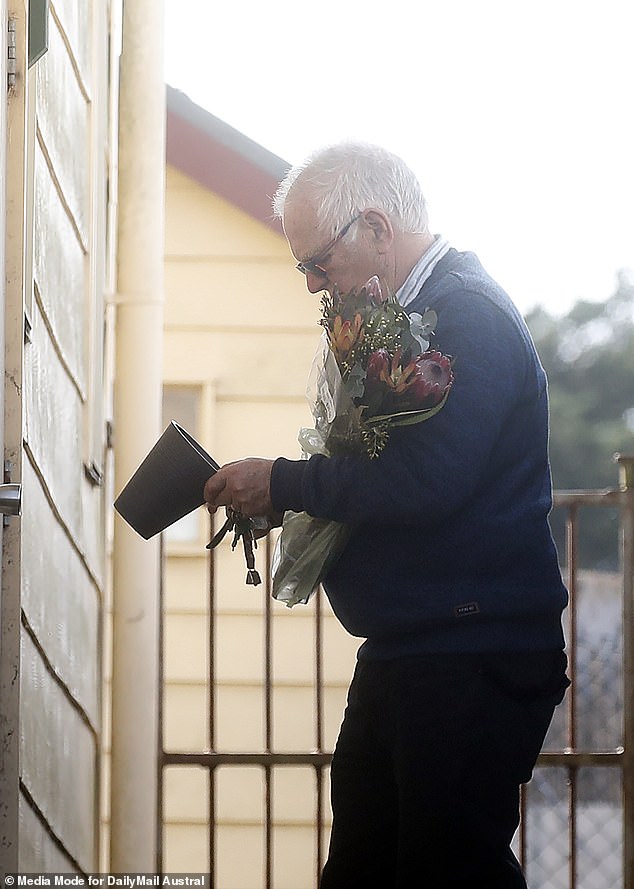 It comes as grieving loved ones have left flowers at the Korumburra Baptist Church, where Mr Wilkinson, who is still fighting for life, is a pastor