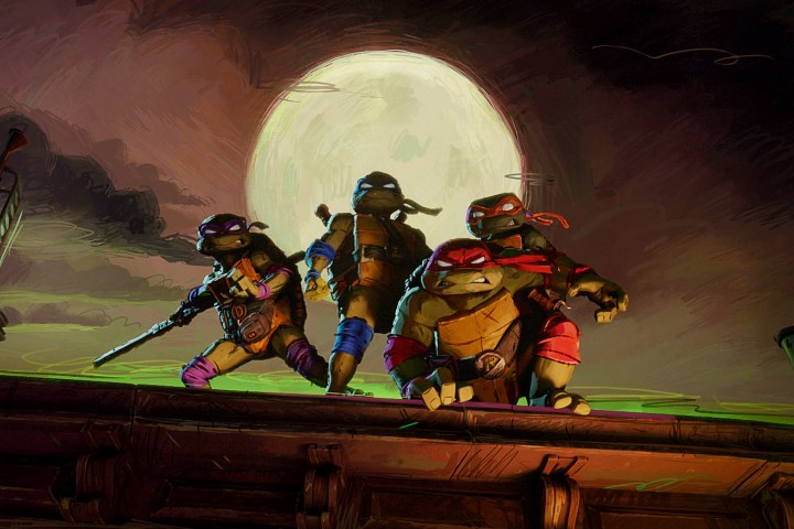 Die Turtles sitzen in TMNT: Mutant Mayhem auf einem Dach.