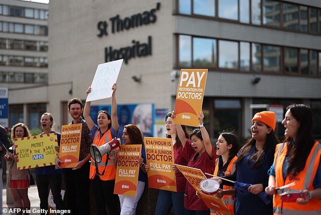Health leaders say the industrial action is hampering efforts to tackle the Covid treatment backlog, with 800,000 appointments and operations cancelled as a result. But they believe the true total may be in excess of a million because many hospitals have avoided scheduling appointments on strike days so they do not need to cancel them. Pictured, junior doctors holding BMA placards on the picket lines outside St Thomas's Hospital in London this morning