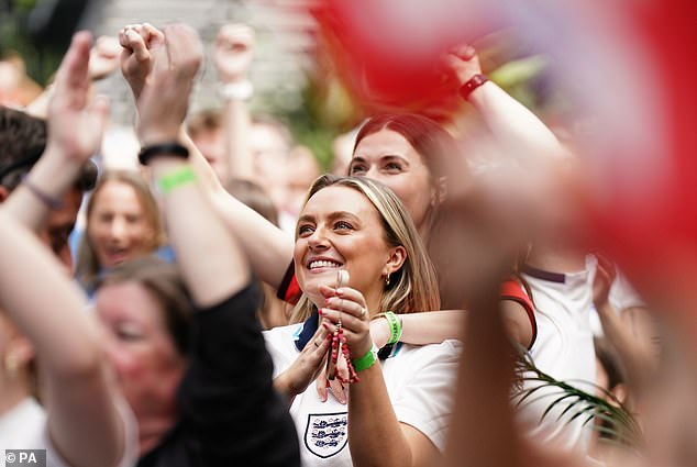 England fans celebrate in Croydon, London, after England score to take the lead