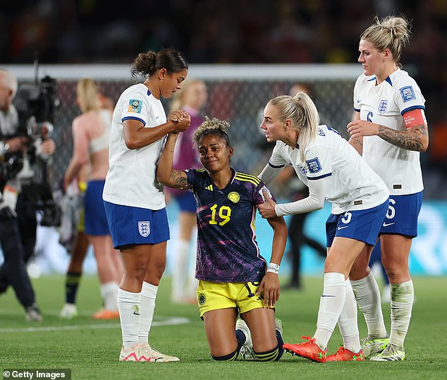 Jorelyn Carabali of Colombia is consoled by Jessica Carter, Alex Greenwood and Millie Bright of England