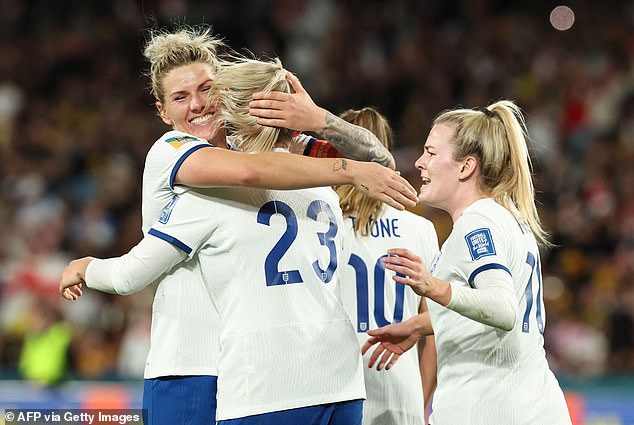 England captain Millie Bright embraces striker Alessia Russo after her goal takes the team 2-1 up