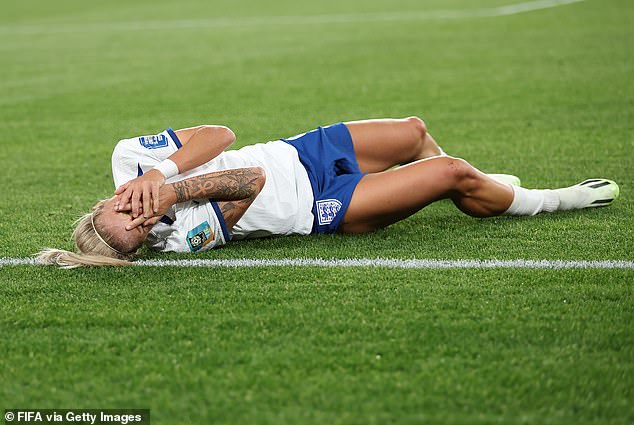 Rachel Daly goes down after a rough tackle which saw her take a blow to the face