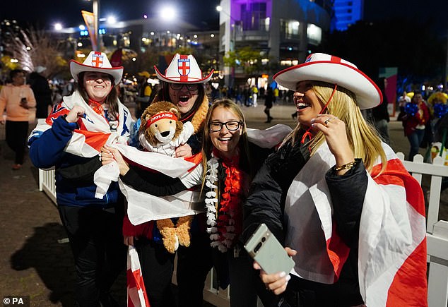 Lionesses fans are all kitted out in red and white flags and hats as they get ready for today's quarter-final