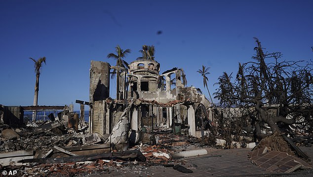 The skeletons of a scorched building sits in the rubble on Saturday, four days after the wildfires began. Experts said Hawaii's abundance of wooden buildings escalated the disaster