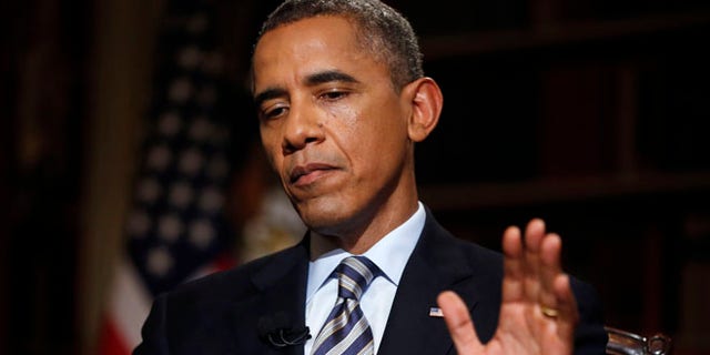 DATEI: 4. Oktober 2013, Präsident Obama während eines Interviews mit The Associated Press in der Bibliothek des Weißen Hauses in Washington, D.C