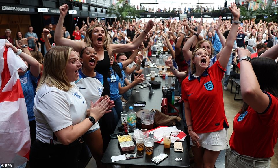 England fans cheer as they watch a live screening of the Women's World Cup semi-final match in London today