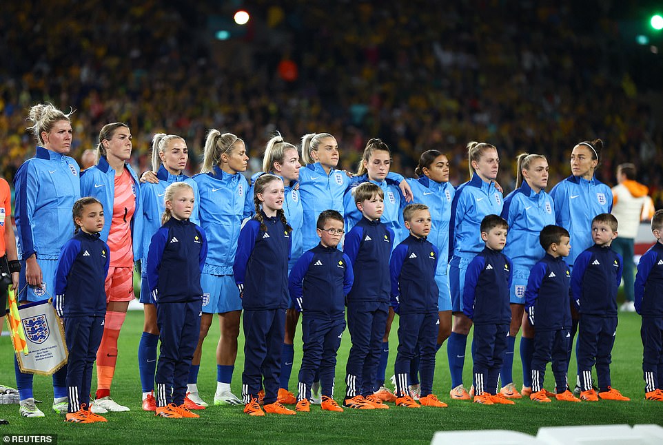 England players line up during the national anthems before the match in Sydney today