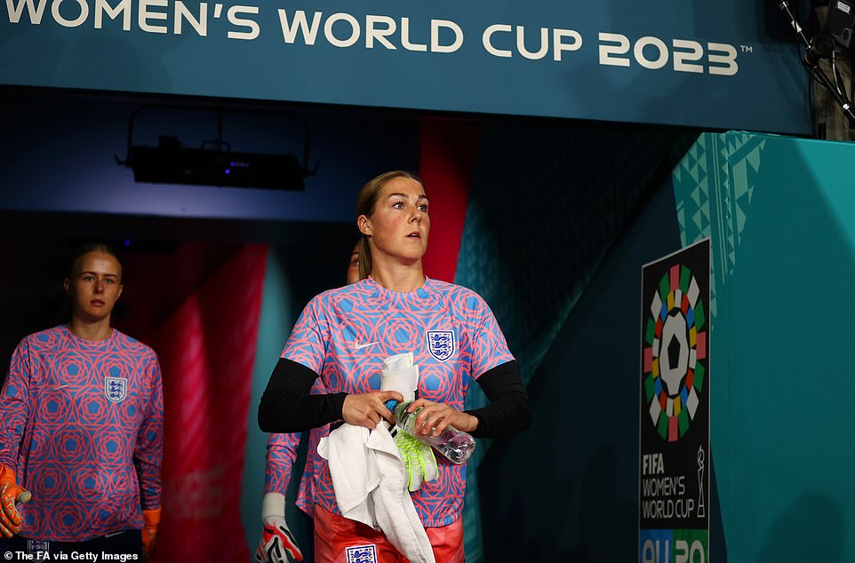 Mary Earps of England looks on as she walks down the tunnel to warm up before today's match