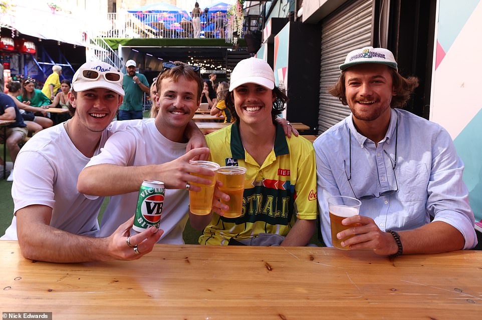 Australian football fans have a beer at Vauxhall Food and Beer Garden in London this morning