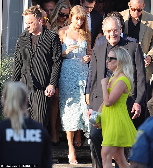 Large crowd: Taylor was seen stepping out of the venue as she held a conversation with fellow guest and star, Channing Tatum
