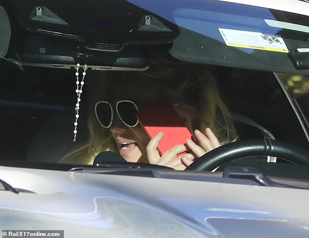 Chatter: The Womanizer singer appeared to be in a discussion while in her vehicle