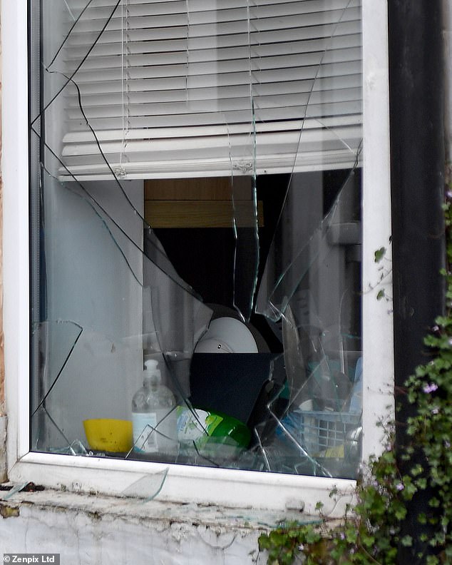 One of the pictures released today appeared to show a smashed window at the father's home