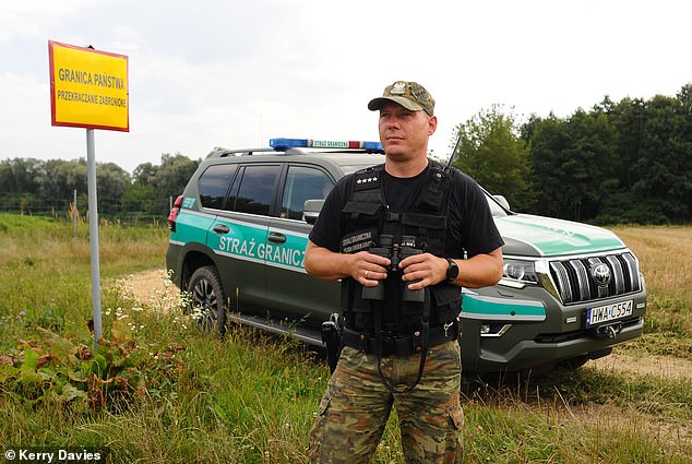 A third of the Polish say they will vote for the hard-Right PiS party, according to the latest polls, as nationalism soars in response to Russia¿s sabre-rattling on its border. Pictured: A Polish Border guard on patrol at the River Bug