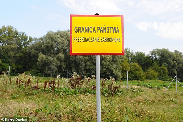 A border warning sign next to the River Bug between Belarus and Poland, half a mile from Terespol border crossing