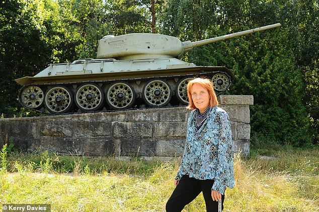 Sue Reid at a memorial of a Russian built T-34 tank known as Stalin's Revenge that was placed near the village of Neple not far from the Polish and Belarus border