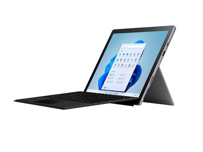 A Microsoft Surface Pro 7+ stands upright with an attached keyboard against a white background.