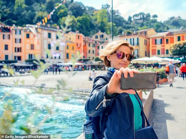 Selfie-loving tourists enjoy posing near the marine, where superyachts bob and each of the 14 coveted berths costs more than £3,000 a day