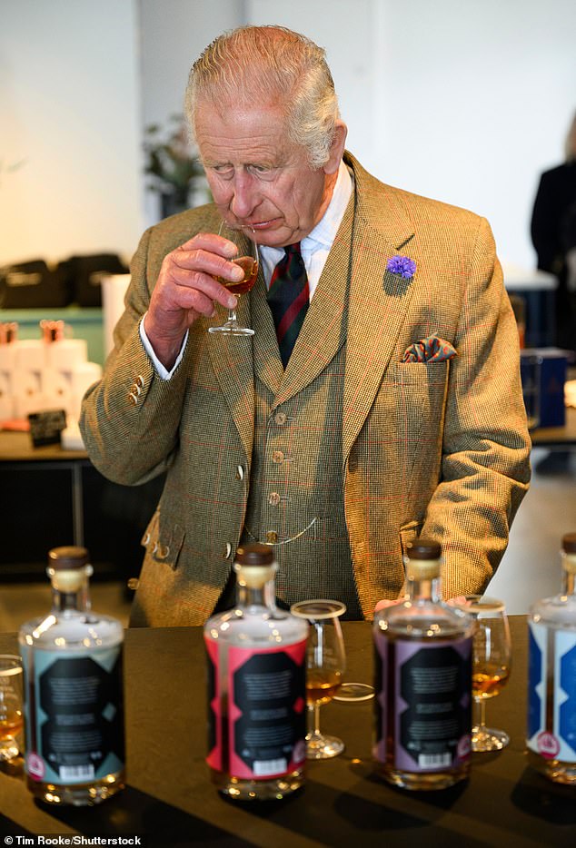 King Charles seen sampling some of the whiskies that are produced at 8 Doors Distillery during his tour