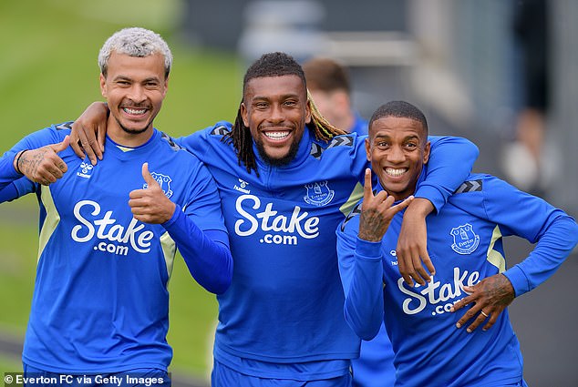 Dele Alli (left) was pictured in Everton's pre-season training yesterday alongside team-mates Alex Iwobi (middle) and Ashley Young (right)