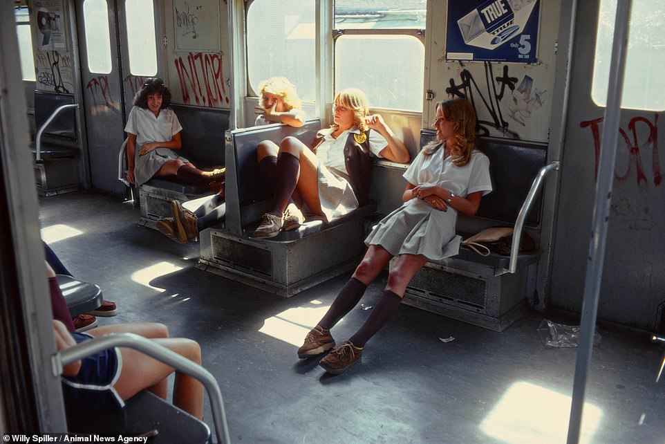 Schoolgirls On the A-Train to Far Rockaway, New York, 1978. A group of friends chat idly while slumped in their seats. Acclaimed photographer Willy Spiller spent two decades capturing the threatening, violent, funny and delightful contradictions of the city's subway