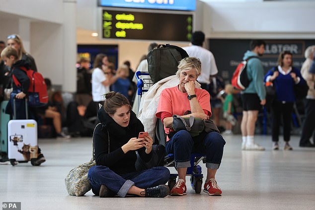 Britain's National Air Traffic Service (Nats) faced a 'technical issue' for several hours on Monday, causing mass disruption to flights in the UK airspace. Above are disrupted passengers at Belfast International Airport on Monday
