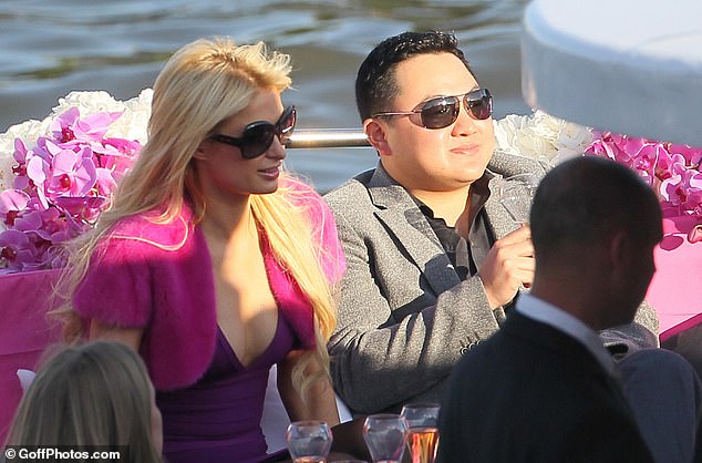 Low is seen with socialite Paris Hilton in 2010. Hilton was also once seen sunbathing on his yacht in France, and partying with him on a number of occasions