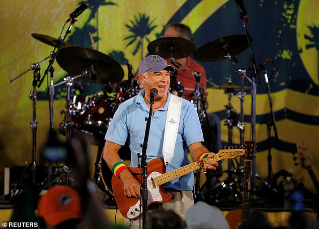Buffett performs during the renaming event of the Miami Dolphins NFL football stadium in 2009. The Dolphins Stadium was renamed LandShark Stadium, after the beer brand that was then owned by Buffett’s Margaritaville Enterprises