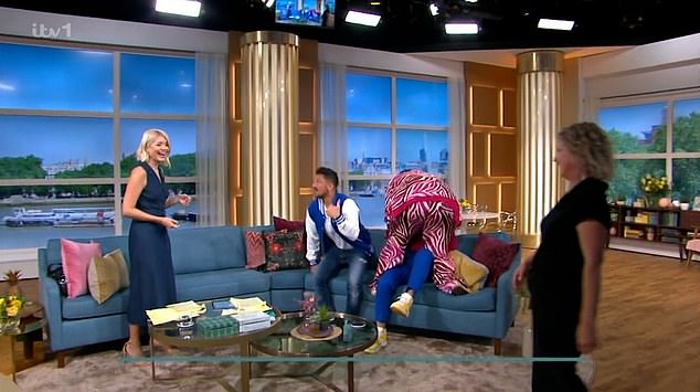 Exuberant: Holly explained: 'Just before he popped into her dressing room and she grabbed him. Then before we went on air she stood on the sofa and mounted him!'
