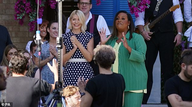 Comeback: It comes after Holly was seen on Monday smiling effusively in a black and white polka dot dress, while dancing along to a rendition of ABBA 's Dancing Queen by the cast of Mamma Mia The Party before embracing her fellow presenter Alison