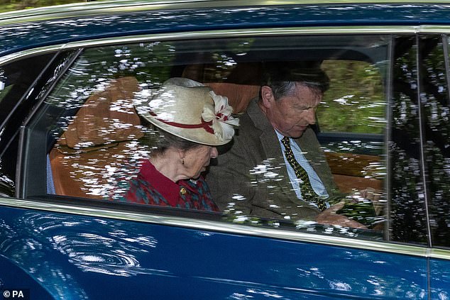 The Princess Royal donned a maroon and grey dress jacket with a straw boater and red trim for the short journey to Crathie Kirk
