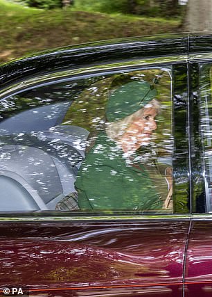 A glimpse of Camilla: The Queen Consort was pictured seated next to the King en route to church on Sunday