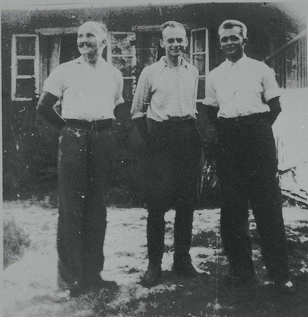 Pilecki standing between the two men he escaped from Auschwitz with, Jan Redzej and Edward Ciesielski (right)