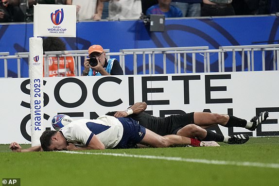 France's Damian Penaud knocks the ball on just before the try line during the Rugby World Cup Pool A match between France and New Zealand at the Stade de France in Saint-Denis, north of Paris, Friday, Sept. 8, 2023. (AP Photo/Christophe Ena)