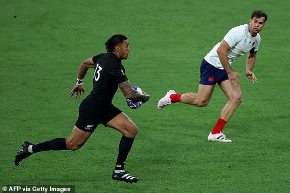 New Zealand's outside centre Rieko Ioane runs with the ball during the France 2023 Rugby World Cup Pool A match between France and New Zealand at Stade de France in Saint-Denis, on the outskirts of Paris on September 8, 2023. (Photo by Thomas SAMSON / AFP) (Photo by THOMAS SAMSON/AFP via Getty Images)