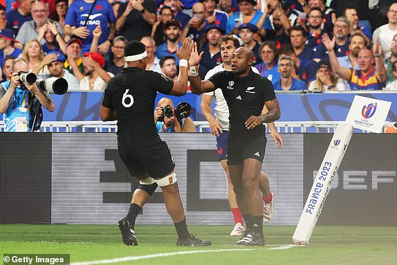 PARIS, FRANCE - SEPTEMBER 08: Mark Telea of New Zealand celebrates scoring his team's first try with Dalton Papali'i of New Zealand during the Rugby World Cup France 2023 Pool A match between France and New Zealand at Stade de France on September 08, 2023 in Paris, France. (Photo by Warren Little/Getty Images)