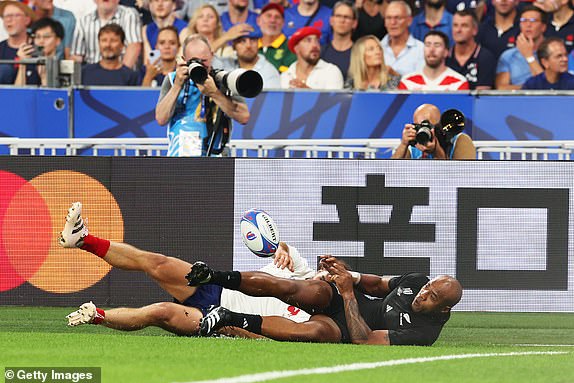 PARIS, FRANCE - SEPTEMBER 08: Mark Telea of New Zealand scores his team's first try during the Rugby World Cup France 2023 Pool A match between France and New Zealand at Stade de France on September 08, 2023 in Paris, France. (Photo by Warren Little/Getty Images)