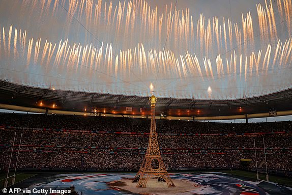 A replica of the Eiffel Tower is seen as fireworks are fired during the opening ceremony of the France 2023 Rugby World Cup ahead of the Pool A match between France and New Zealand at the Stade de France in Saint-Denis, on the outskirts of Paris on September 8, 2023. (Photo by Thomas SAMSON / AFP) (Photo by THOMAS SAMSON/AFP via Getty Images)