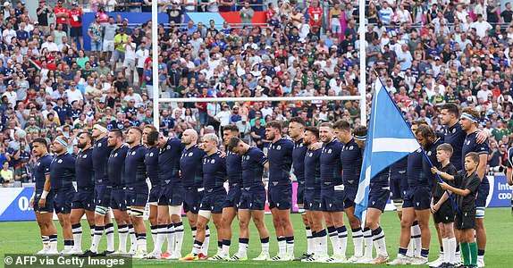 Scotland's players line up for the playing of the national anthems ahead of the France 2023 Rugby World Cup Pool B match between South Africa and Scotland at Stade de Marseille in Marseille, southern France on September 10, 2023. (Photo by Pascal GUYOT / AFP) (Photo by PASCAL GUYOT/AFP via Getty Images)
