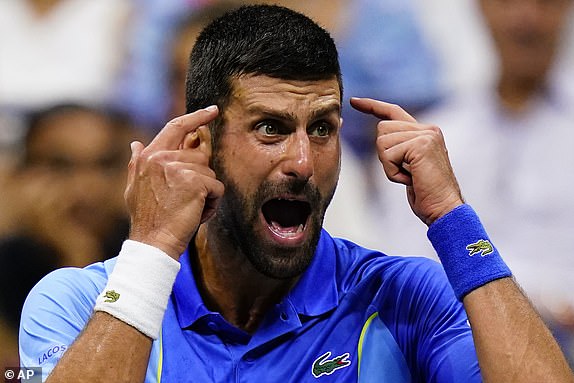 Novak Djokovic, of Serbia, reacts during a break in play against Daniil Medvedev, of Russia, during the men's singles final of the U.S. Open tennis championships, Sunday, Sept. 10, 2023, in New York. (AP Photo/Frank Franklin II)