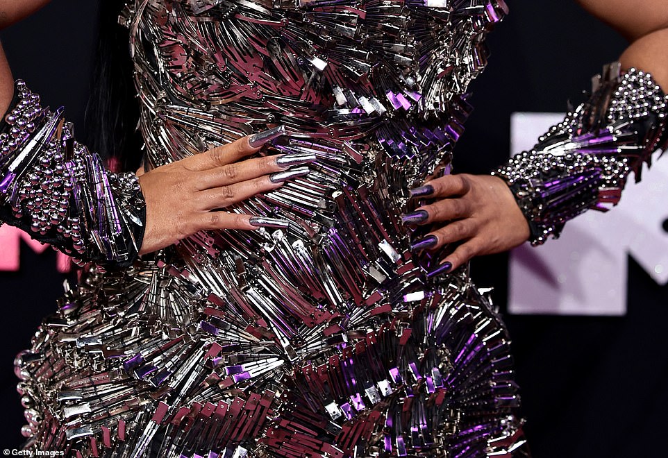 Closer look: The dress was made up of a countless number of hair clips in different directions