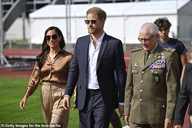 Meghan and Prince Harry, Duke of Sussex with General Luigi Miglietta