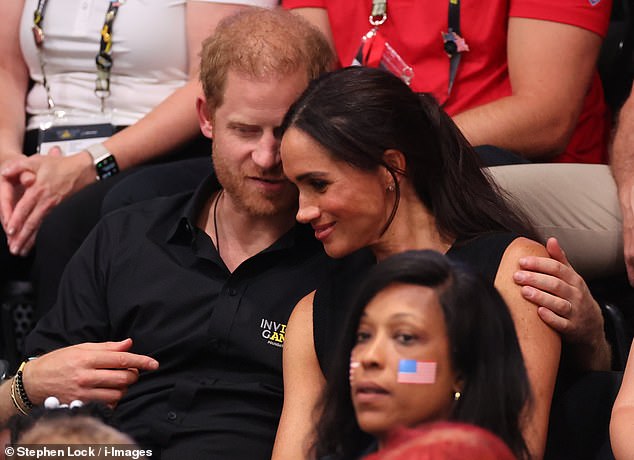 The Duke and Duchess of Sussex looking loved-up at the Invictus Games in Dusseldorf